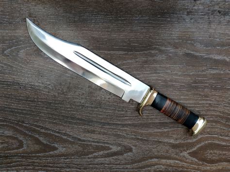 23 44. . Crocodile dundee knife with sheath for sale